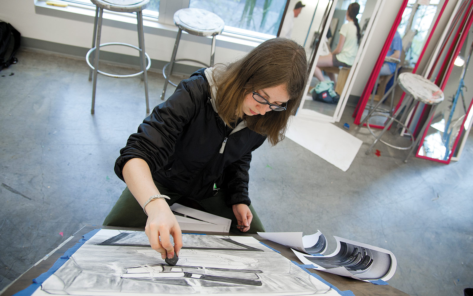 There always seems to be something going on in art buildings. Art is also a great thing to photograph because you get a nice general shot - the girl doing the charcoal drawing with the mirrors and the stools - and then detail shots are grea…