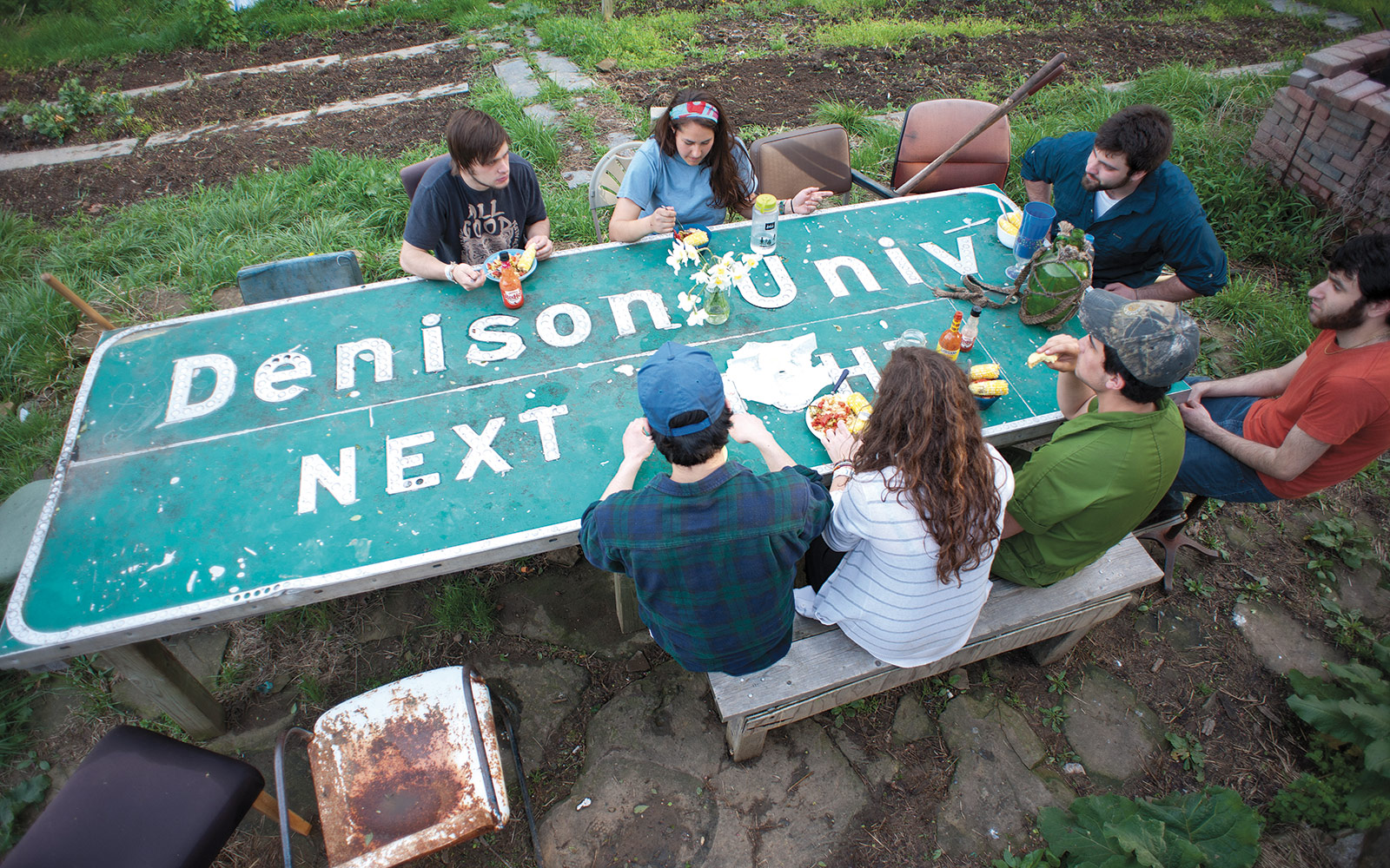 The sign has been there for years and years. The students have repurposed it as their dinner table.