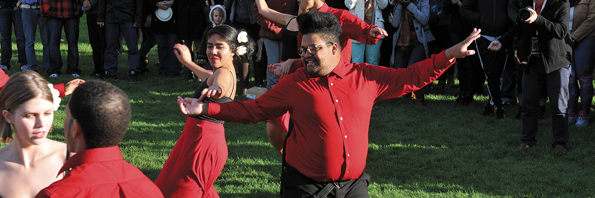 Juan Bernabe performs with fellow dancers on the Common during D-Day