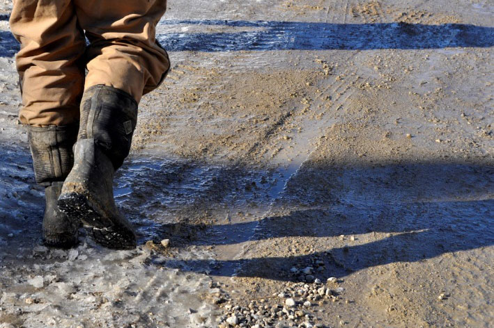 person in boots walking