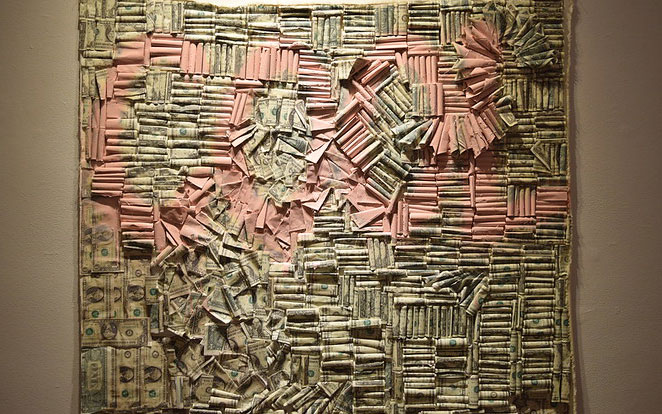 Wall of one dollar bills creating the word "Cool"