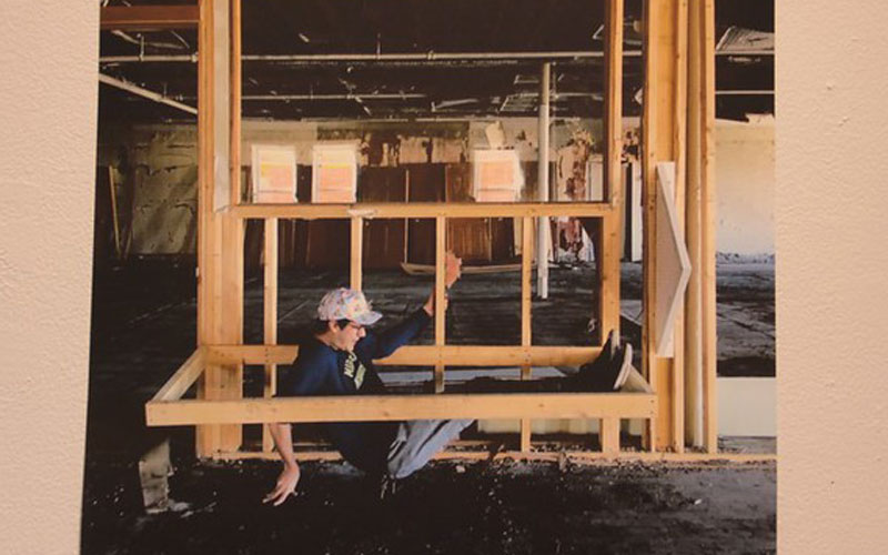 photo of figure inside wooden frame