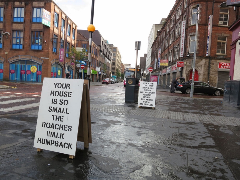 City streets with sidewalk signs