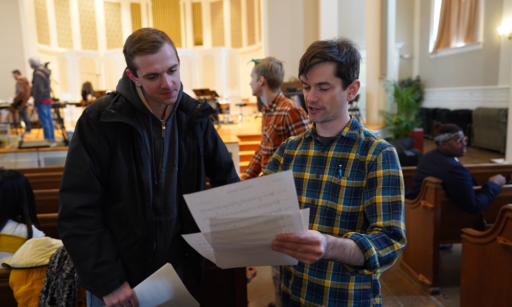 TUTTI festival - people discussing sheet music