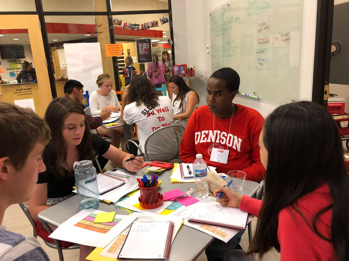 Students sitting at table in Red Frame lab