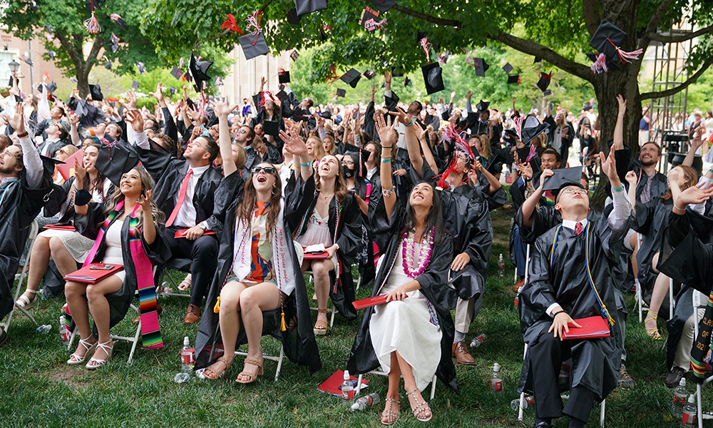 Students throwing their graduating caps