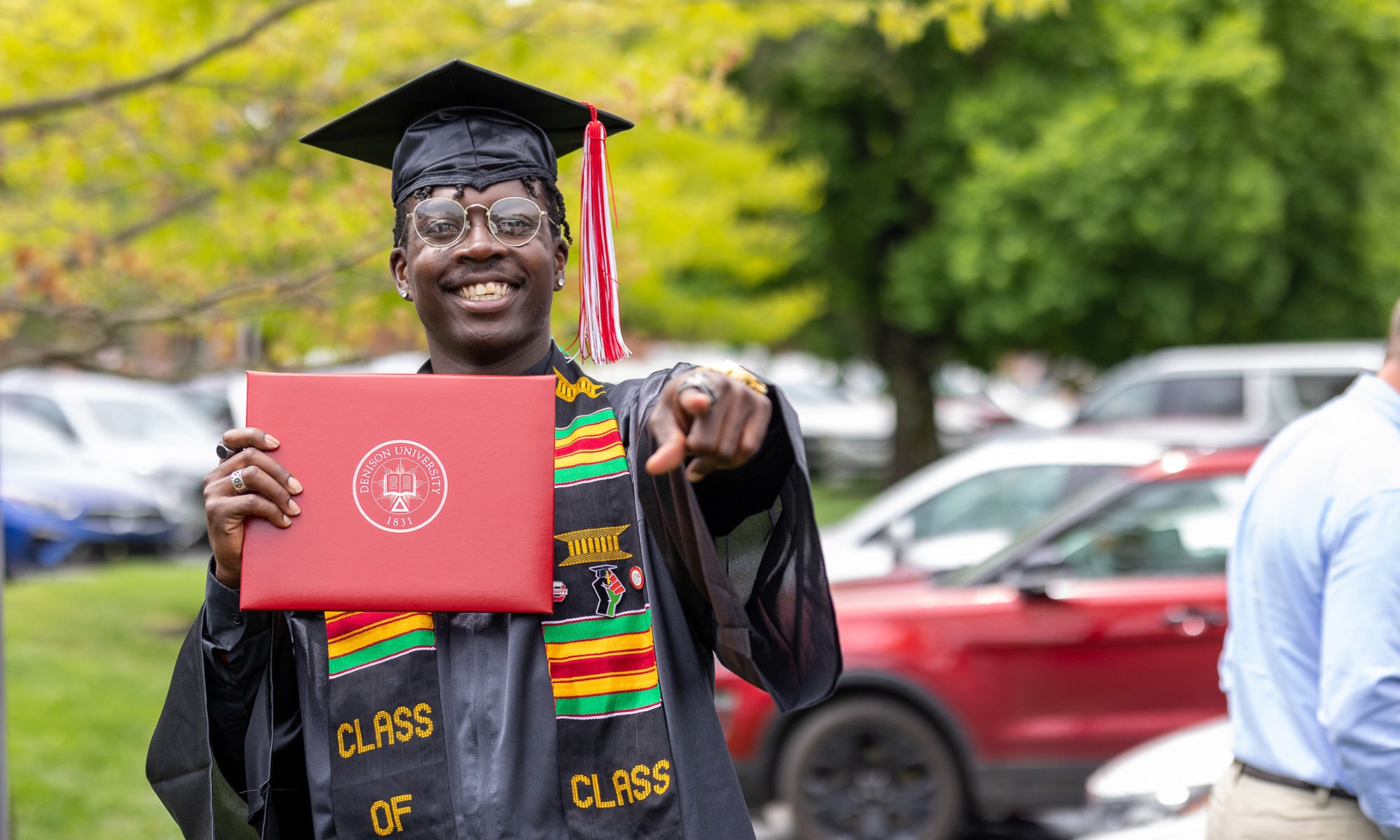 Student showing off their diploma