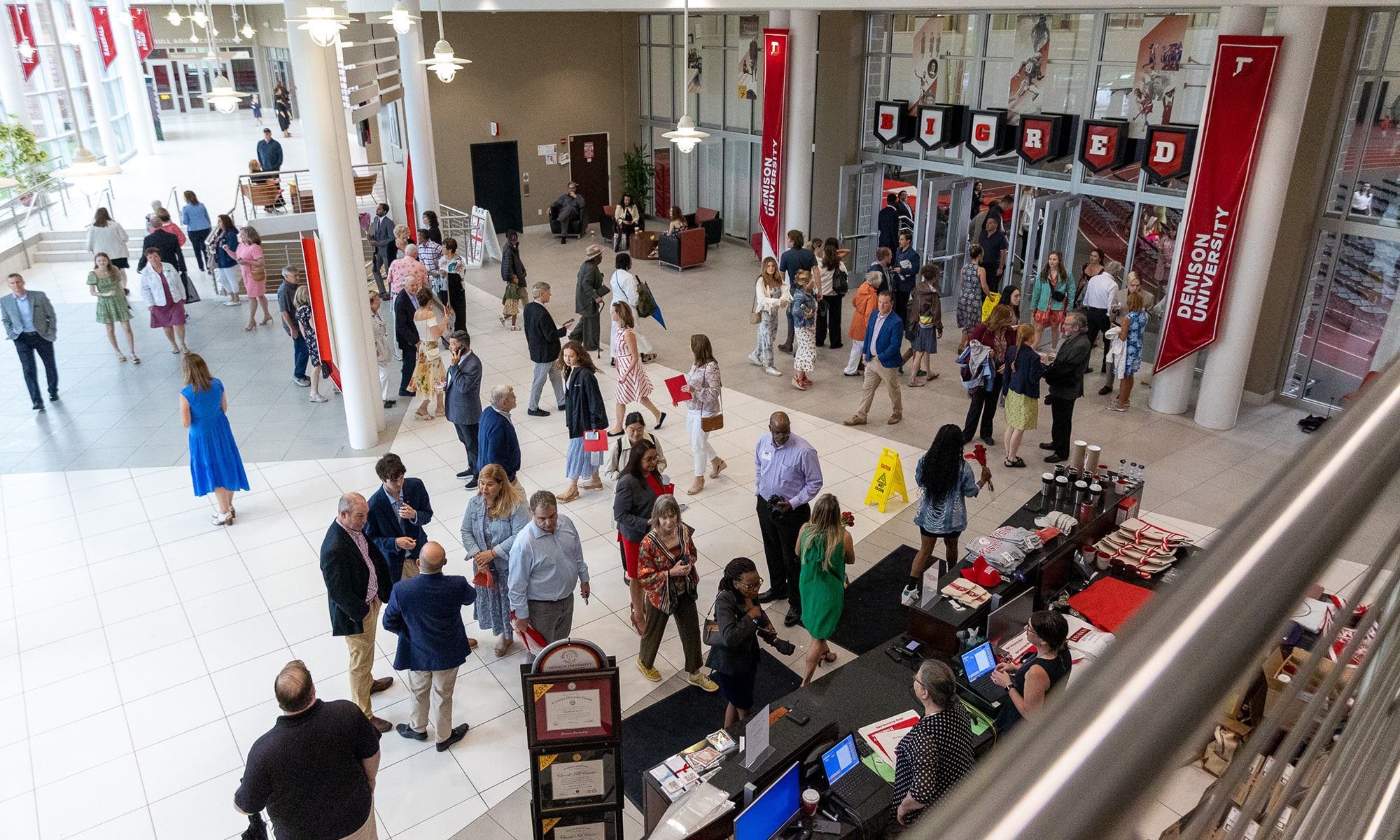 Families and friends enter the Mitchell center