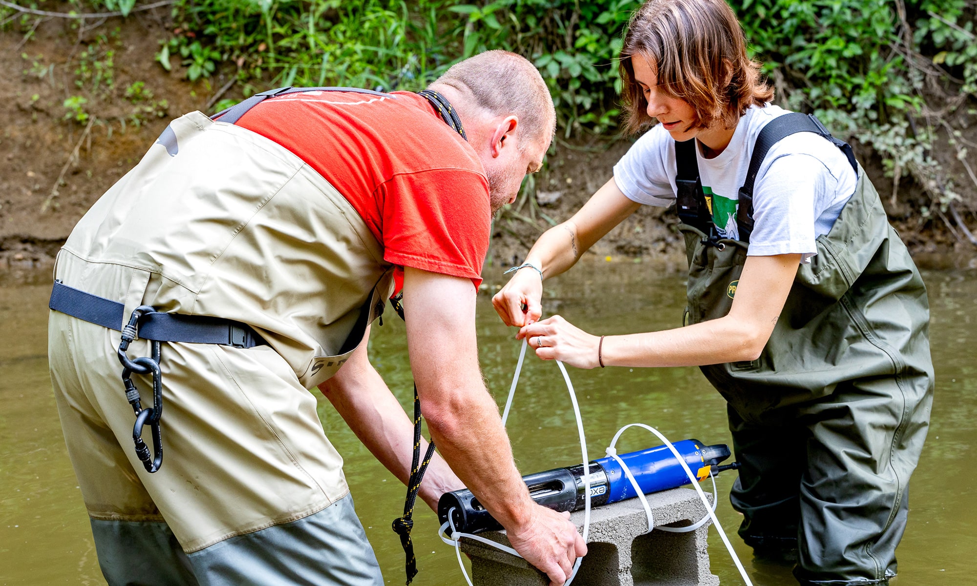 Caroline Lopez helps professor Dave Goodwin secure a data collection device