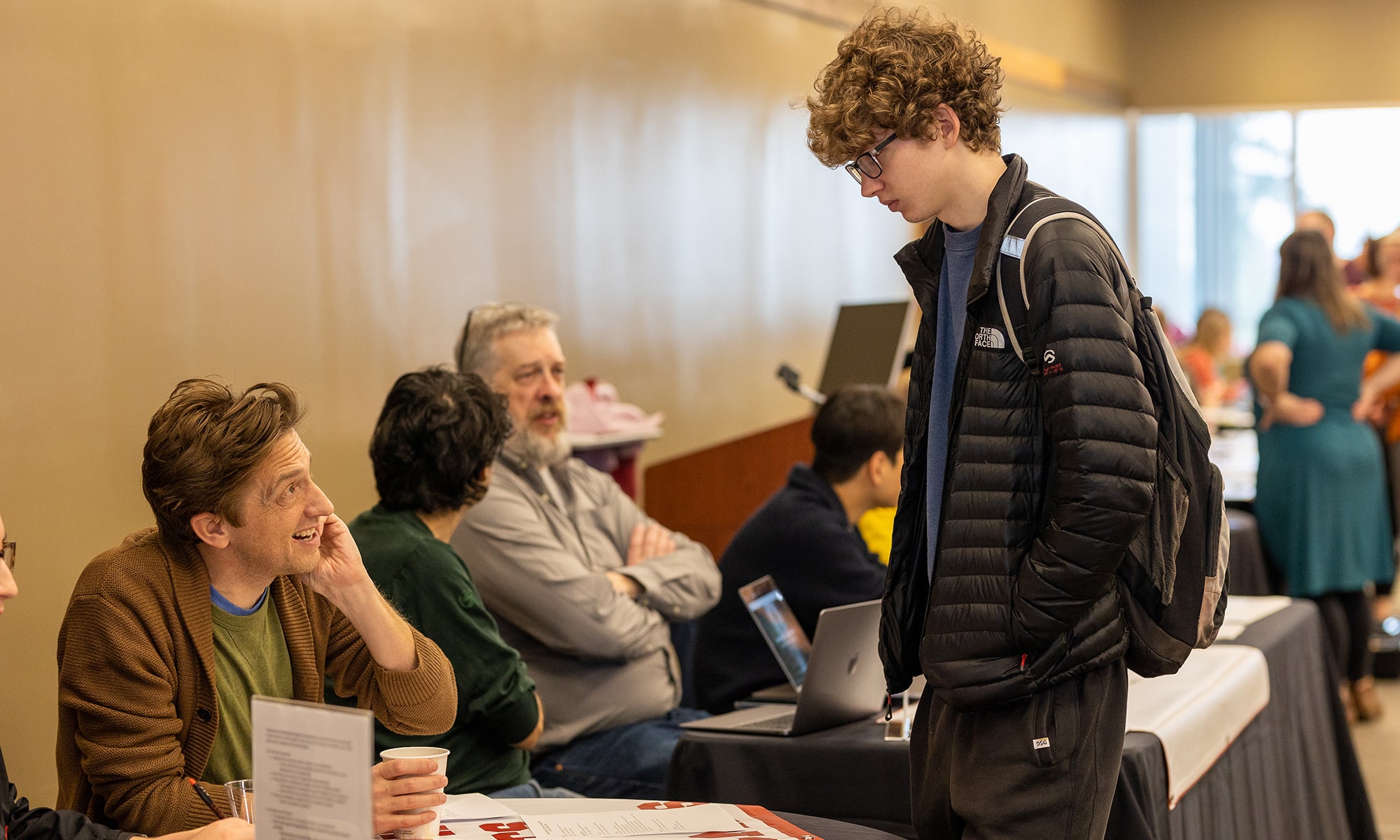 Student talking to professor