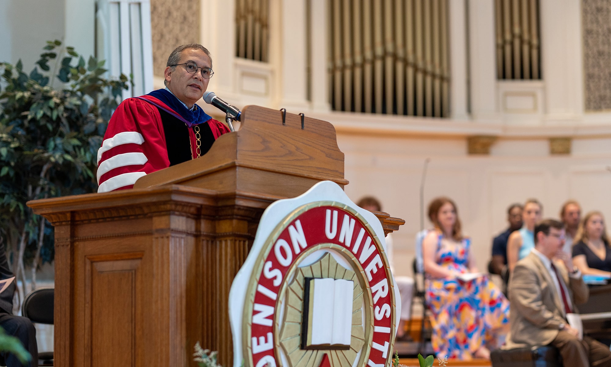 President Adam Weinberg speaking at the podium