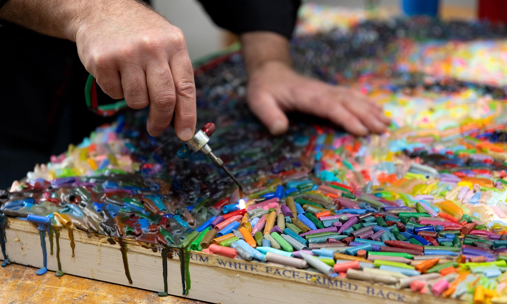 Christian Faur working on his art work in his home studio