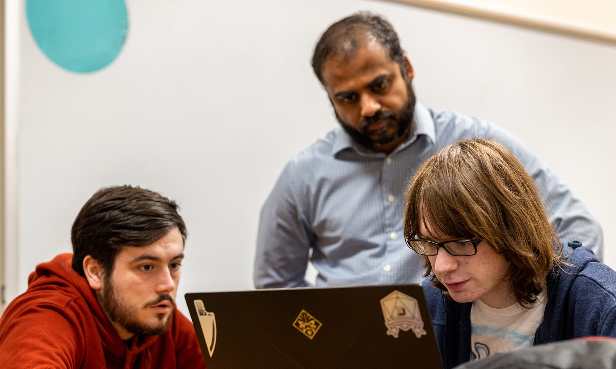 Malcolm McDonough (right) with student and professor