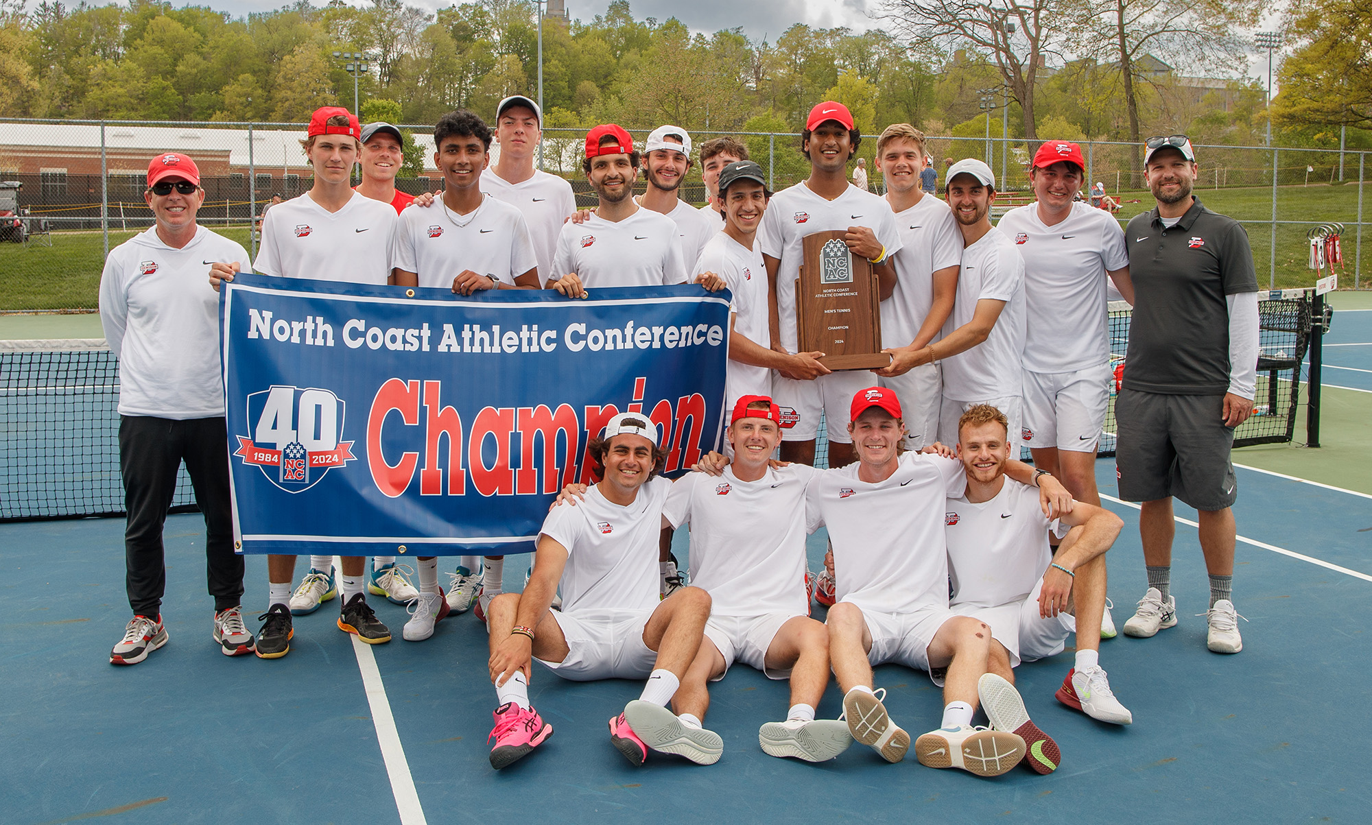 Team photo with NCAC championship banner