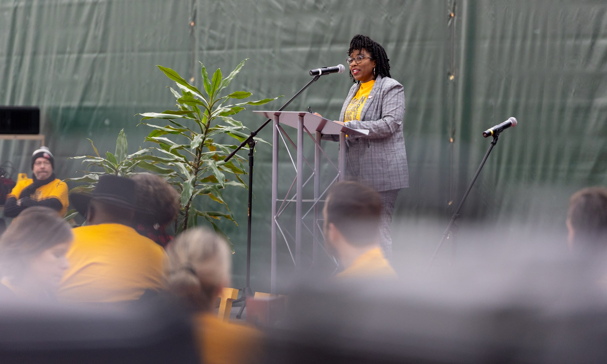 Nicole Ausmer, senior associate vice president of Student Life, addresses the crowd at a brunch inside the Mitchell Center.  