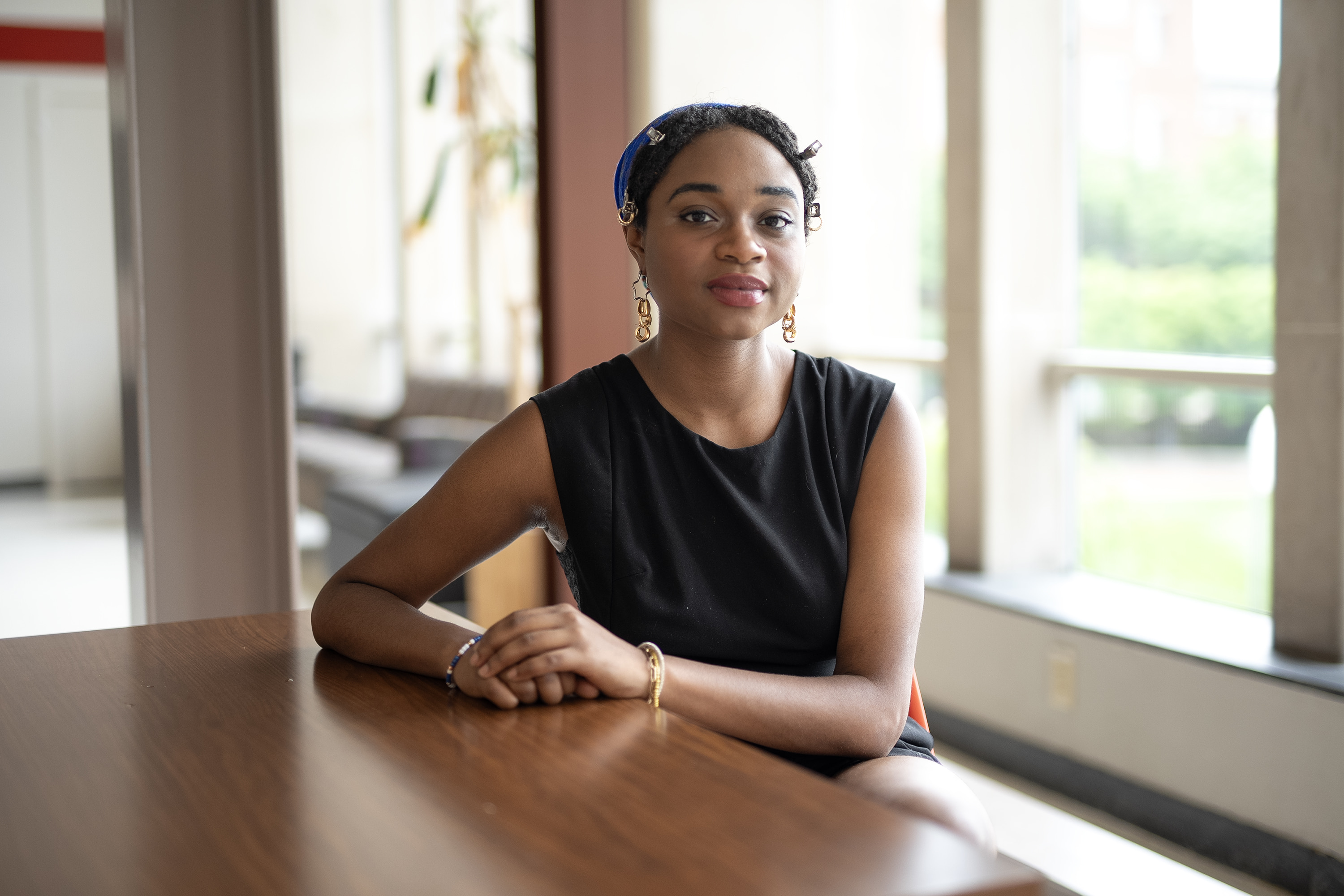 Zora Whitfield sitting at a table