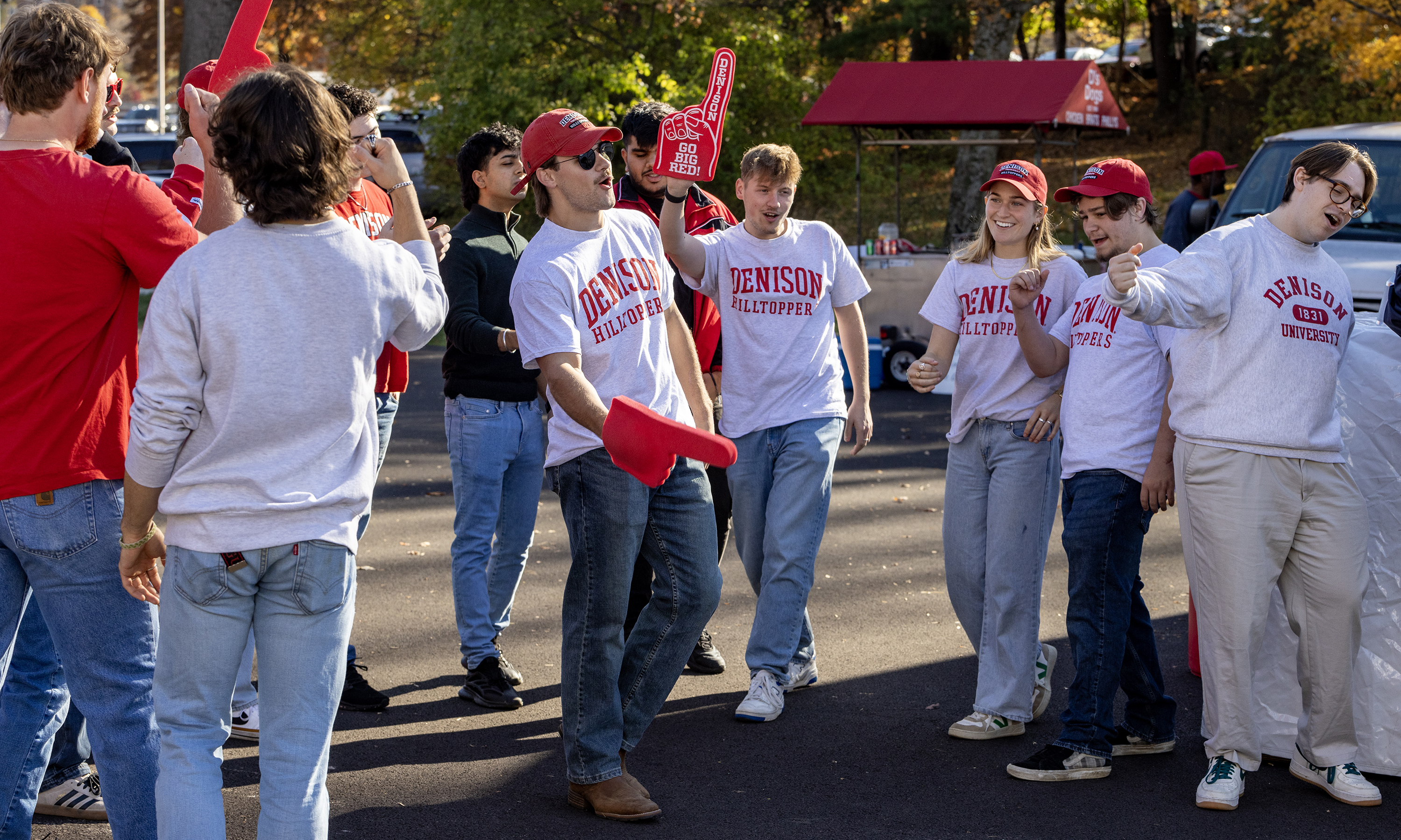 A group of students singing a cappella in a parking lot