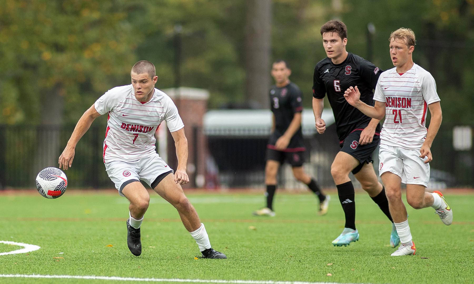 Men's soccer in action on the field.