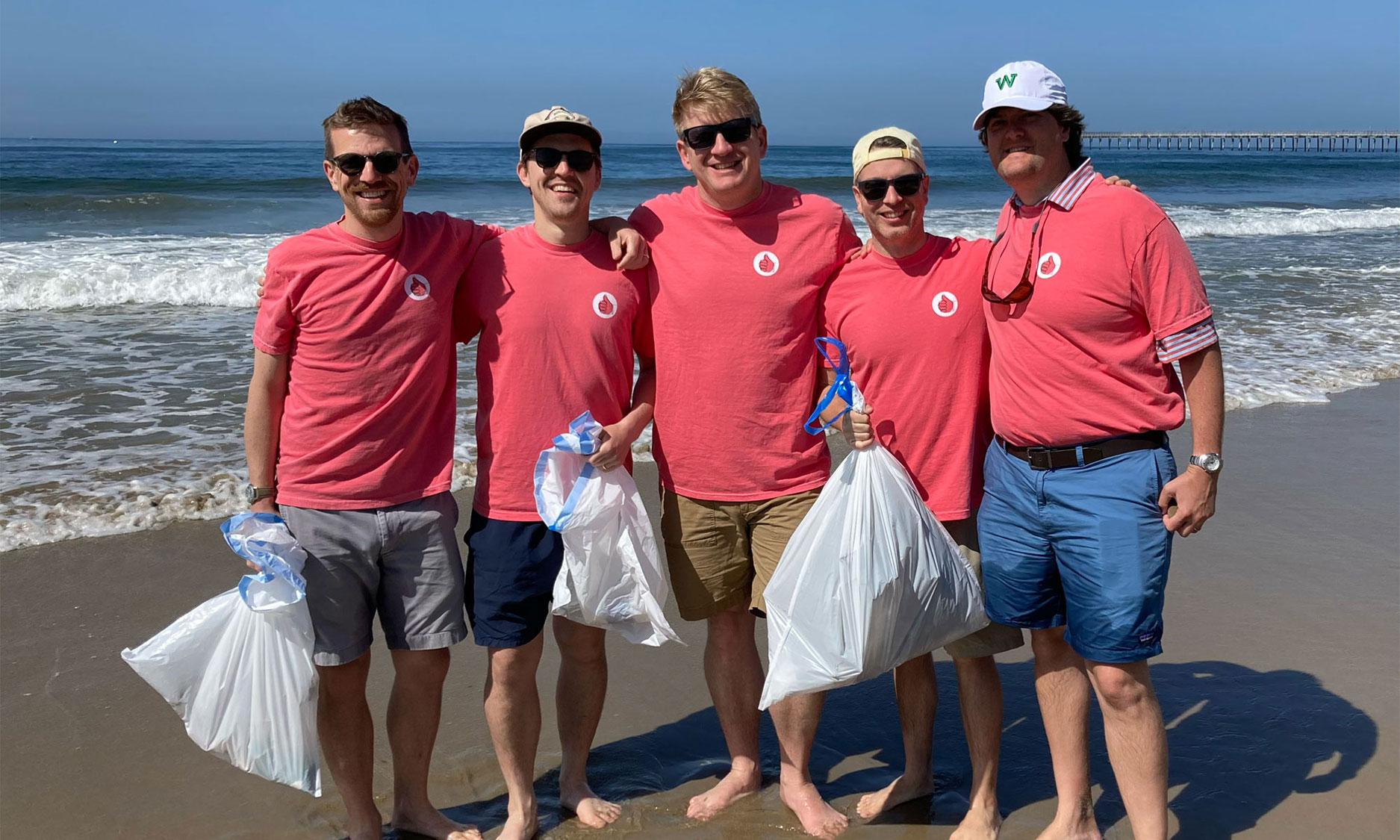 The residents of stone 105 picking up trash at the beach