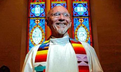 A photo of Hal Taussig preaching