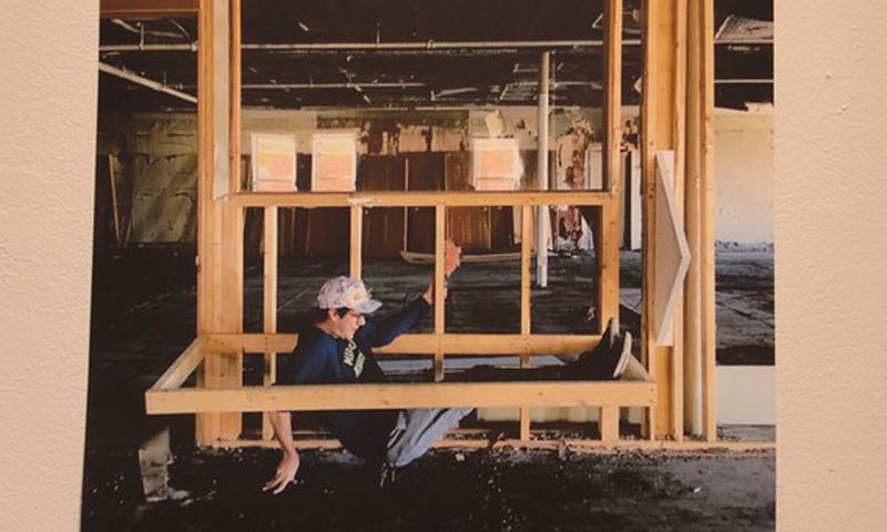 photo of figure inside wooden frame