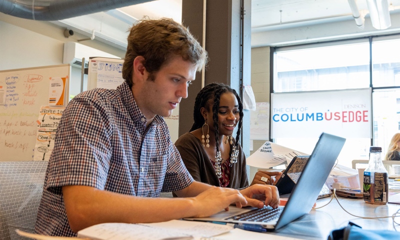 Two students working at a computer