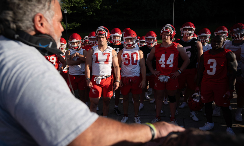 Head Coach talking to football team