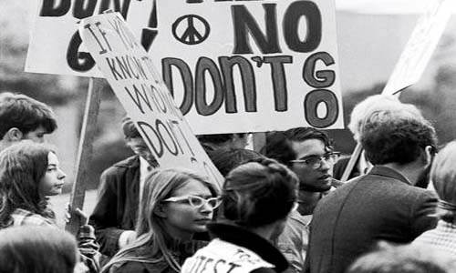 Black and white photo of people from a screening of the 2016 film “The Draft and the Vietnam Generation.”