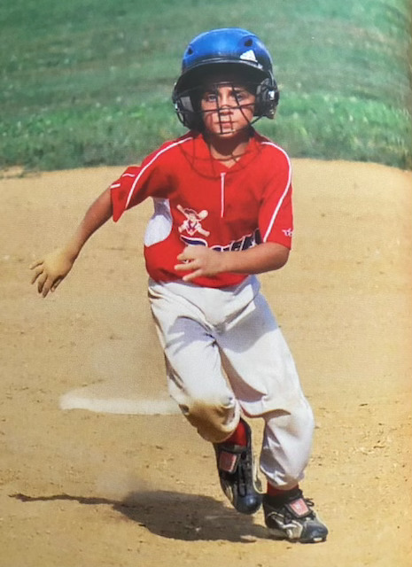 Eric Colaco playing in little league as a child.