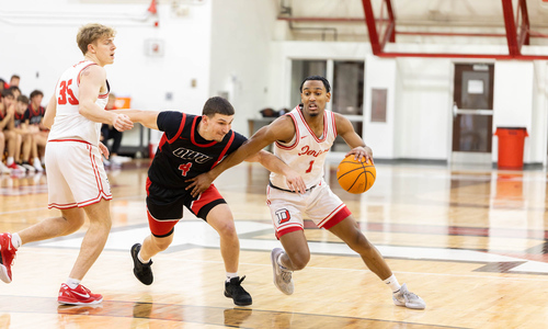 Photo of Denison's Kellon Smith playing basketball against OWU.