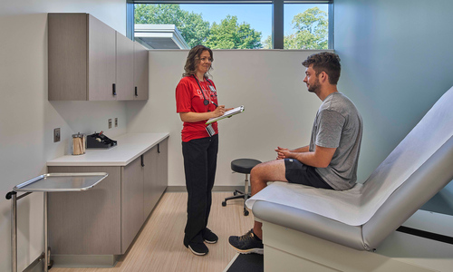 Person in conversation with a medical professional