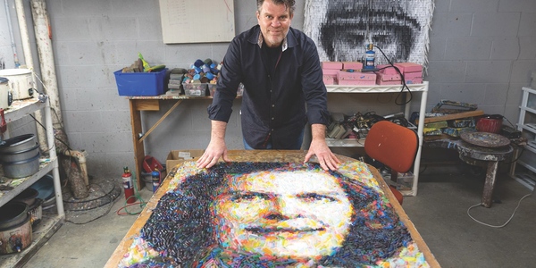 Christian Faur displays a photo-realistic portrait of American mathematician Julia Robinson made from crayons. 