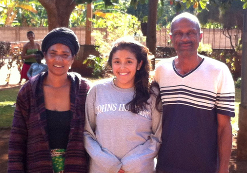 Adela Hoffman '10 with her Peace Corps homestay parents in Mozambique.