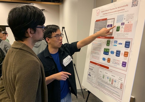 Son Tran presenting a poster board at a conference in Los Angeles