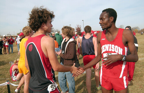 Dee Salukombo shaking hands