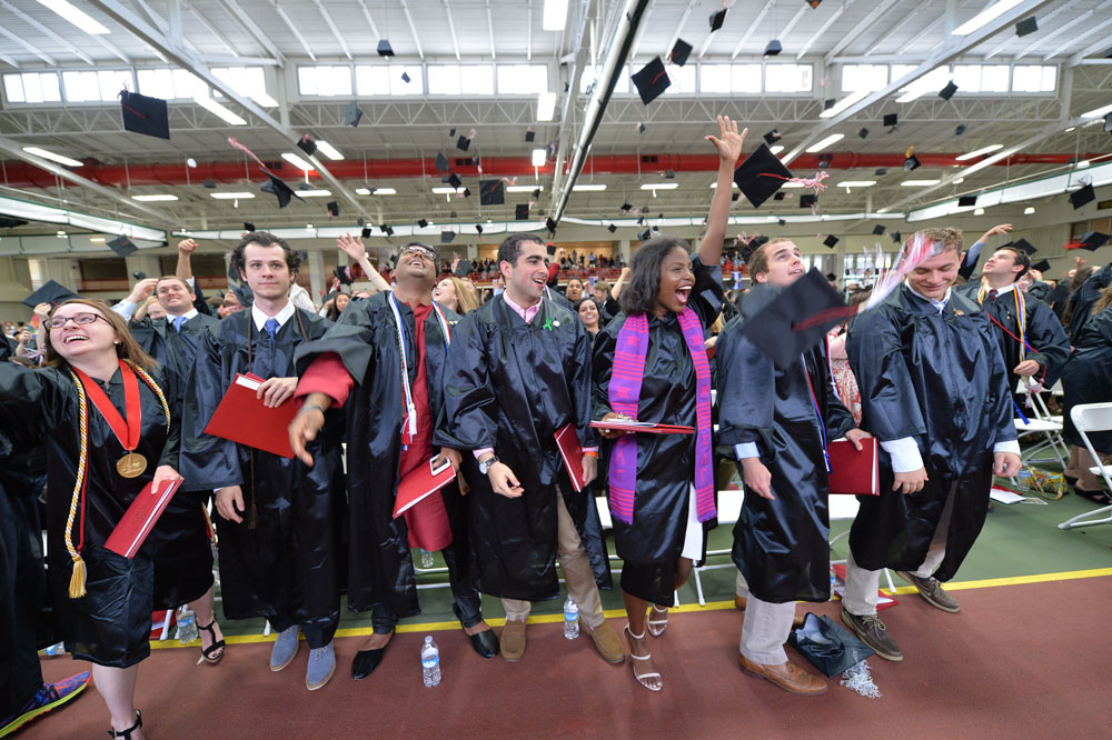 Graduated students throwing caps