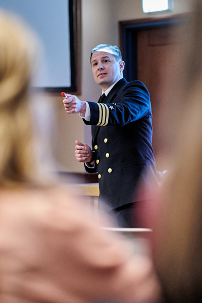 Commander David C. Clark '99 speaking at honors day