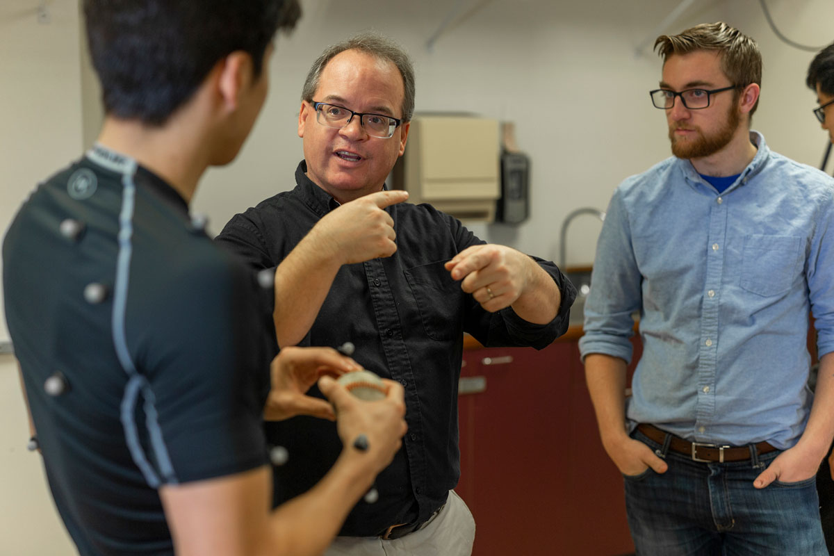 Students discuss data with professor