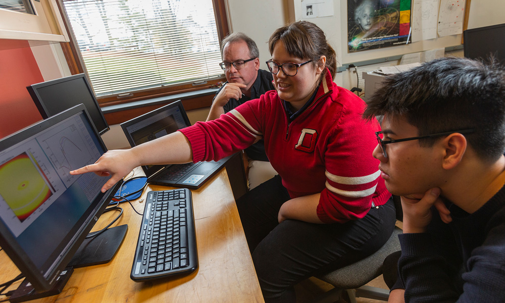 Prof. Steve Doty, Angela Sommerer ’20, and Tran Anh Nguyen ’20