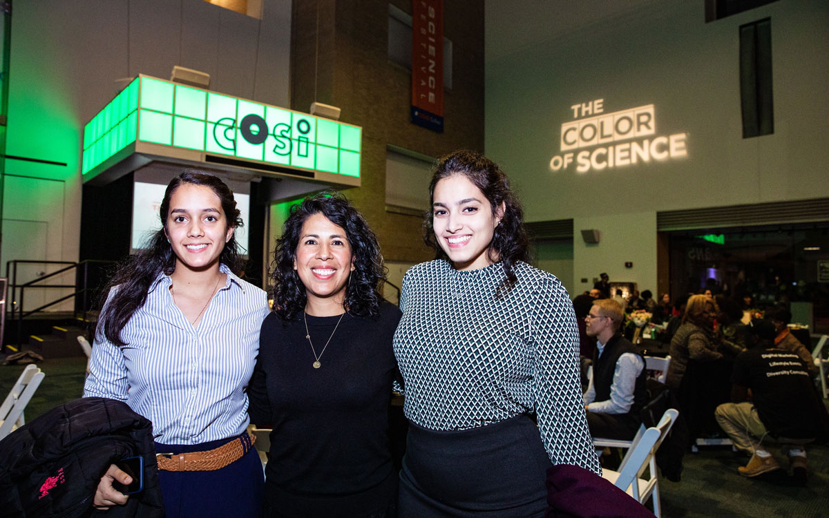 Prof Aguilar with two students at COSI