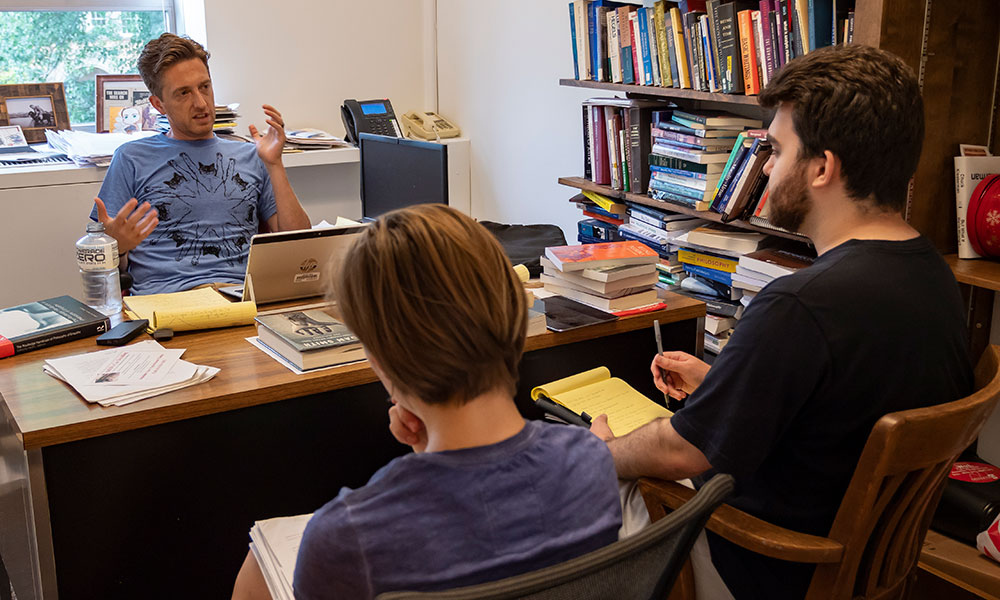 Professor John McHugh, Benjamin Keefer '19 and Audrey Kirkley '20