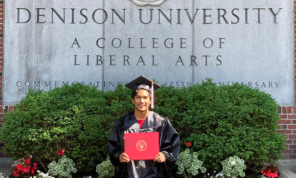 Taka Higuchi '20 celebrating commencement