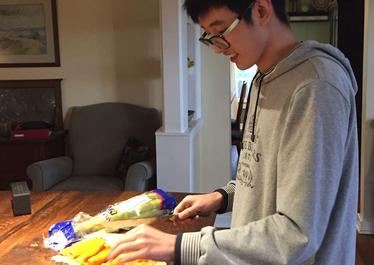 Student helping in the kitchen