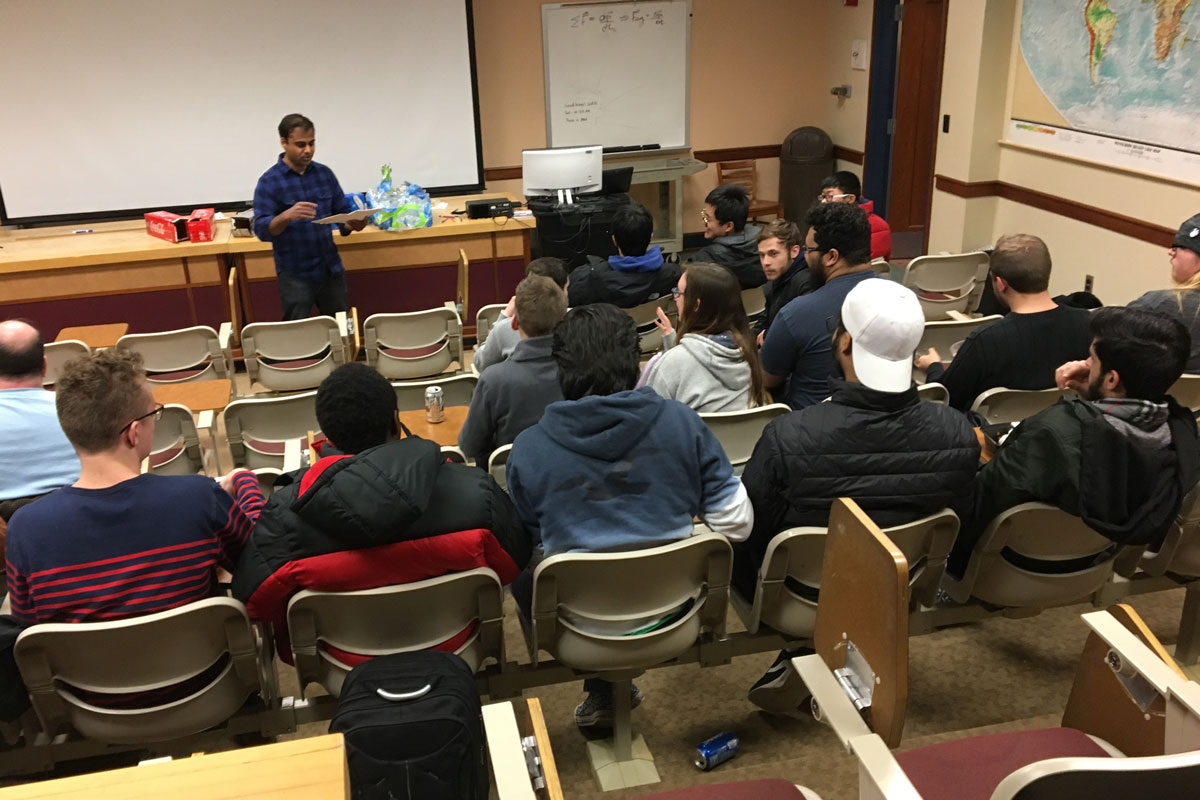 Students listening to professor speak