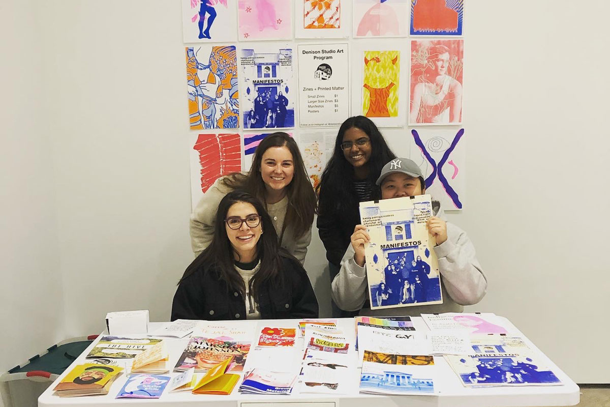 Studio Art Students at bookfair table