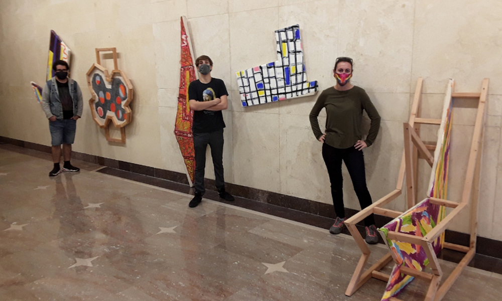 Students with artwork