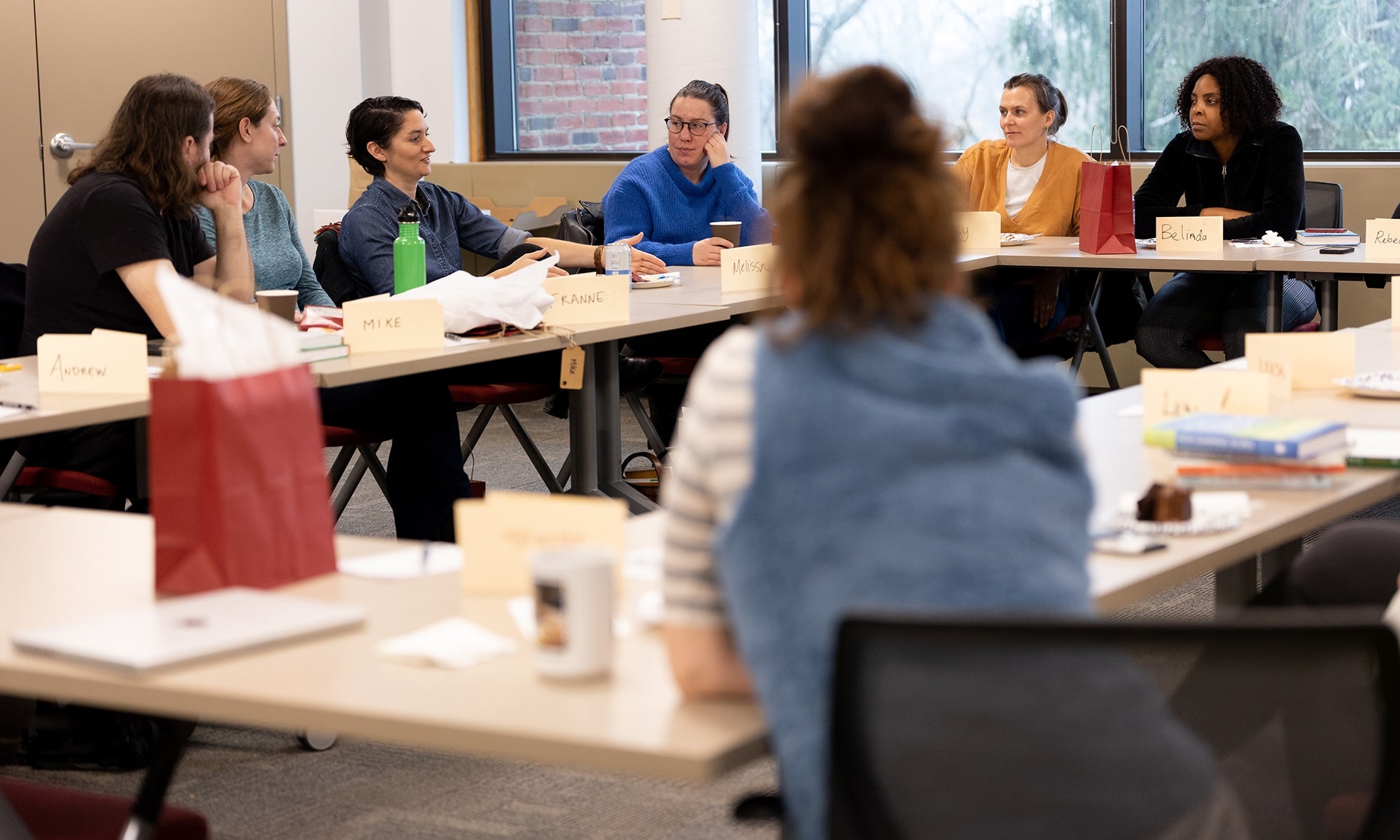 Faculty members sitting together in the classroom