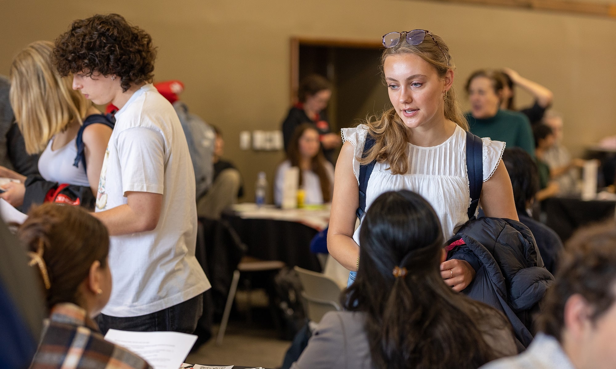 Students visiting each table