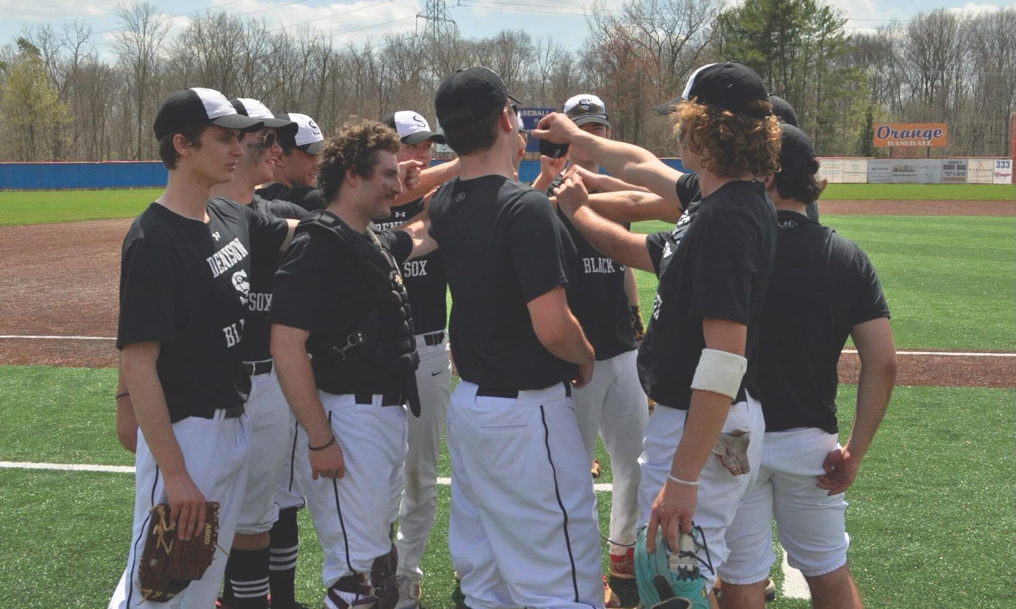 Denison Baseball Players in a Huddle