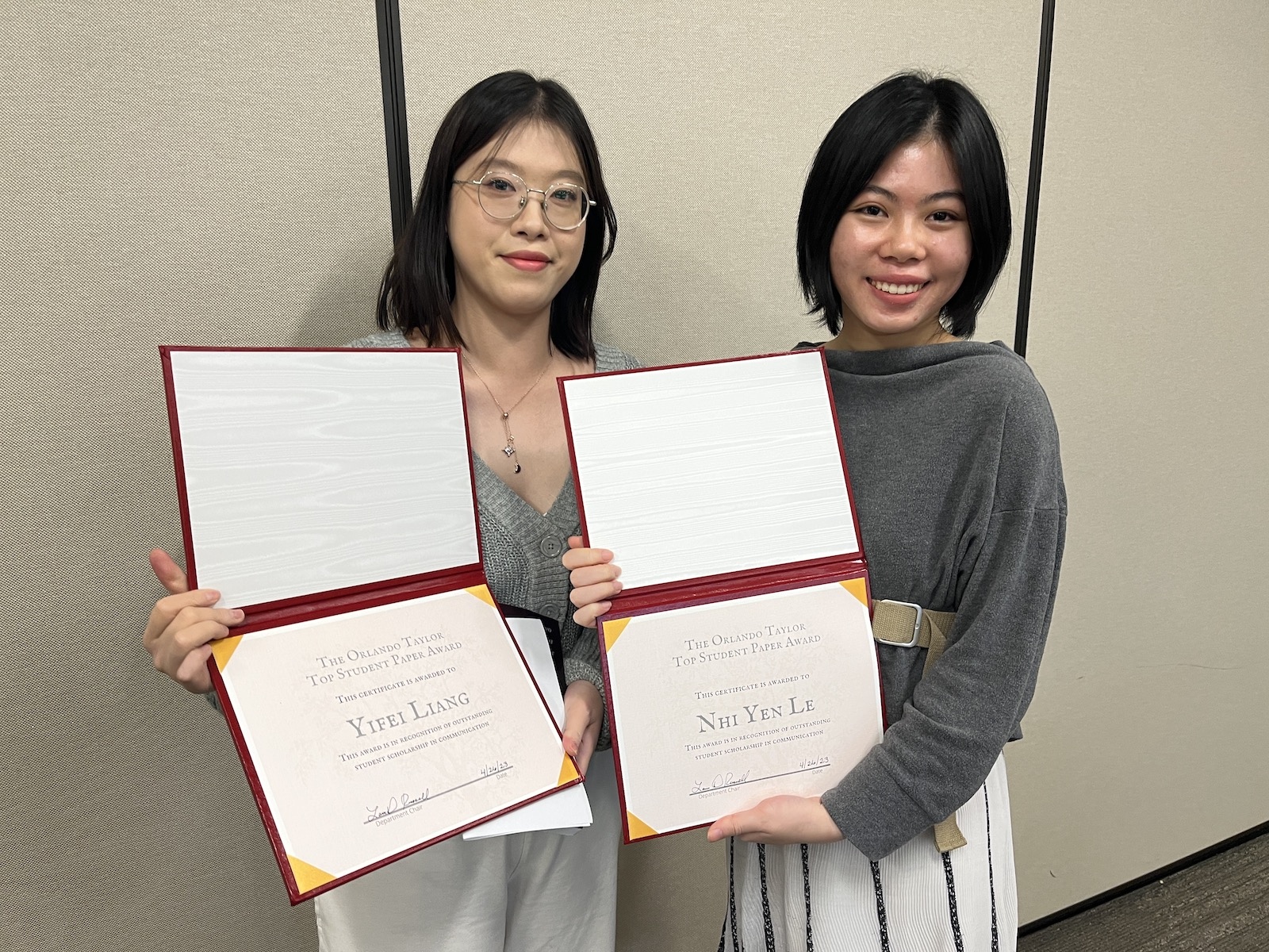 Yifei Liang and Nhi Yen Le holding their awards